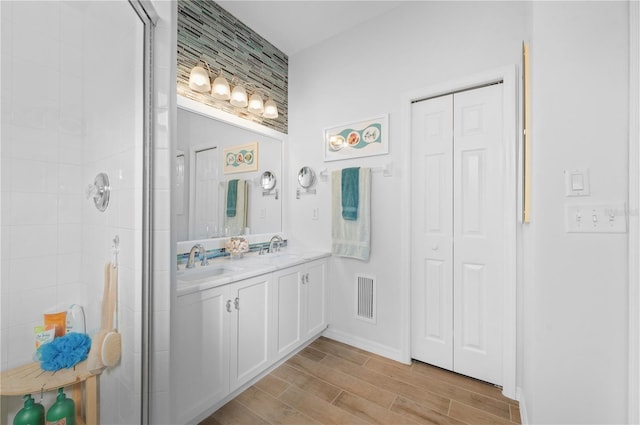 bathroom with vanity and an enclosed shower