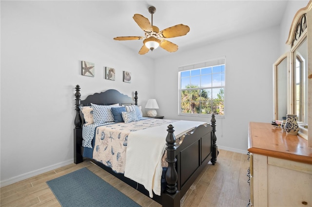 bedroom with hardwood / wood-style flooring and ceiling fan