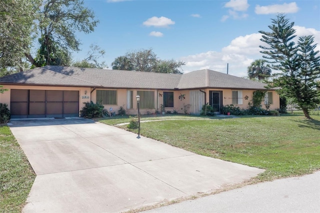 ranch-style house featuring a garage and a front yard