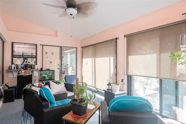 sunroom with ceiling fan and vaulted ceiling