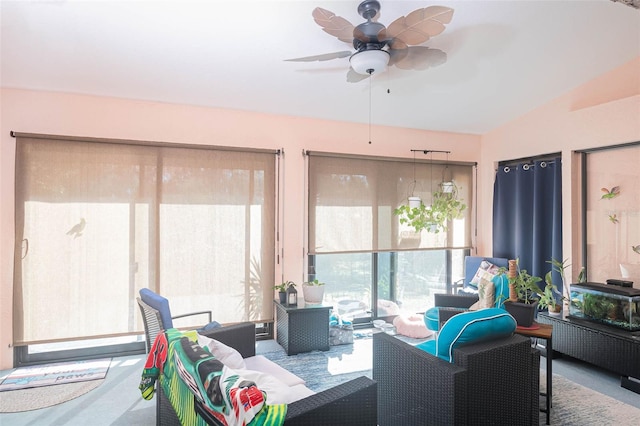 sunroom / solarium featuring ceiling fan and lofted ceiling