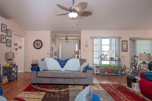 living room featuring ceiling fan and hardwood / wood-style floors