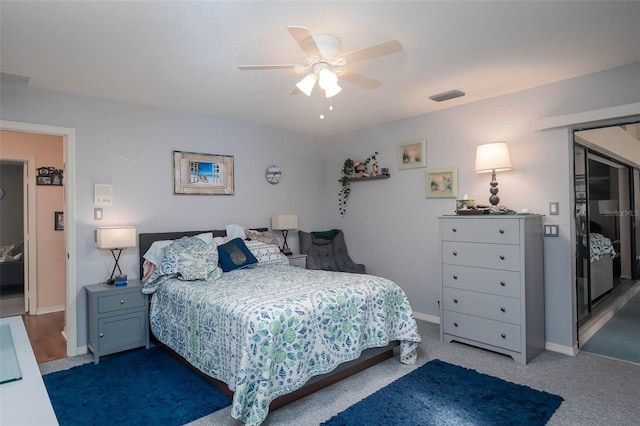 carpeted bedroom with ceiling fan