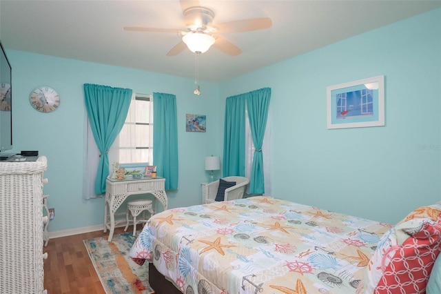 bedroom featuring hardwood / wood-style floors and ceiling fan