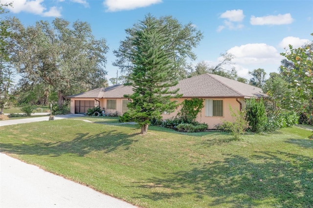 single story home featuring a front yard and a garage