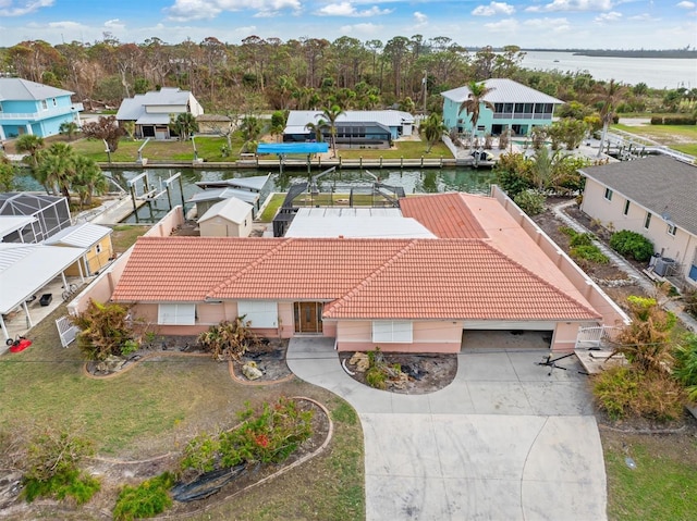 birds eye view of property featuring a water view