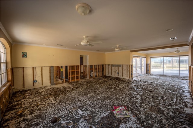 spare room with crown molding and ceiling fan