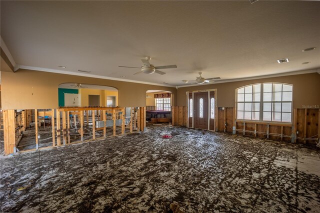 interior space with crown molding and ceiling fan