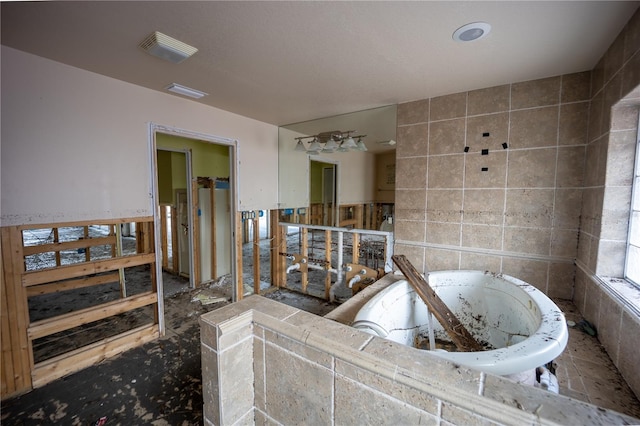 bathroom featuring tile walls