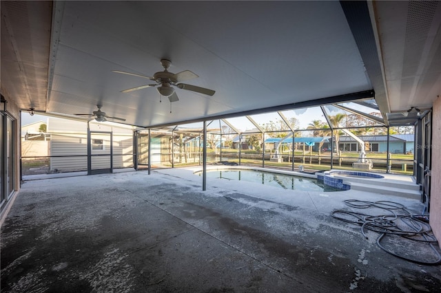 view of swimming pool with an in ground hot tub, a lanai, and a patio