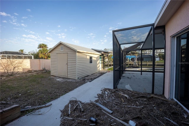 exterior space with a patio and a shed