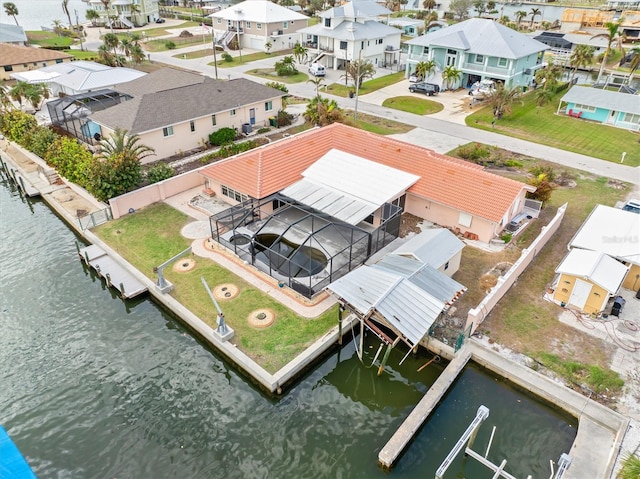 bird's eye view featuring a water view and a residential view