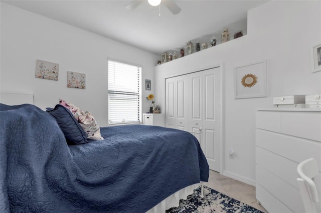 bedroom with ceiling fan and a closet