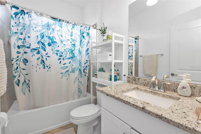 full bathroom featuring shower / tub combo with curtain, vanity, and toilet