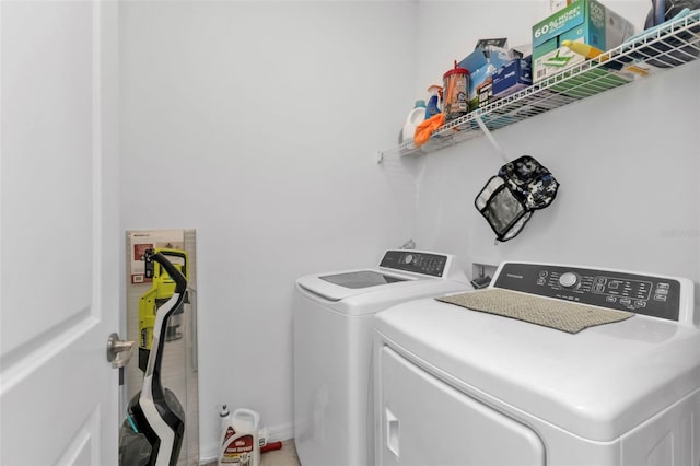 laundry area with washing machine and clothes dryer