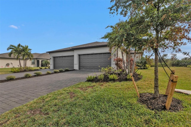 ranch-style home with a front yard and a garage