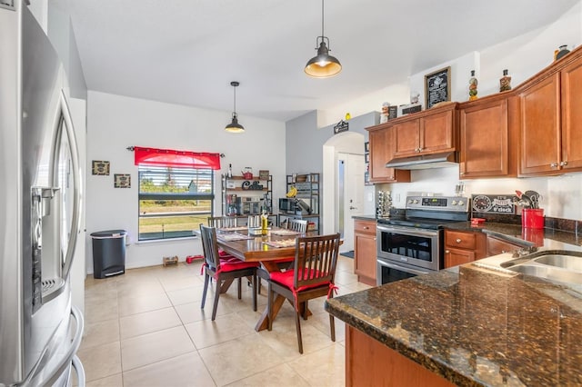 kitchen with sink, light tile patterned flooring, pendant lighting, and appliances with stainless steel finishes