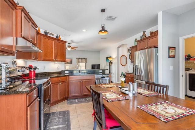 kitchen with sink, hanging light fixtures, ceiling fan, light tile patterned floors, and stainless steel appliances