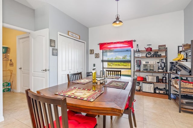 dining area featuring light tile patterned floors