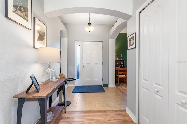 foyer entrance featuring hardwood / wood-style floors