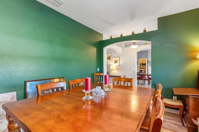 dining area with hardwood / wood-style floors