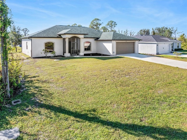 view of front of property featuring a front lawn and a garage