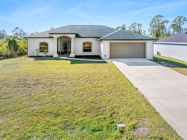 view of front of home featuring a garage and a front yard