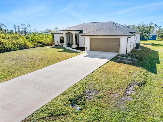 view of front of property featuring a garage, central air condition unit, and a front lawn