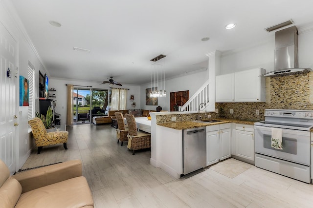 kitchen featuring dishwasher, white cabinets, white electric range, sink, and wall chimney range hood