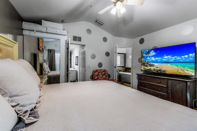 bedroom with ensuite bathroom, ceiling fan, and lofted ceiling