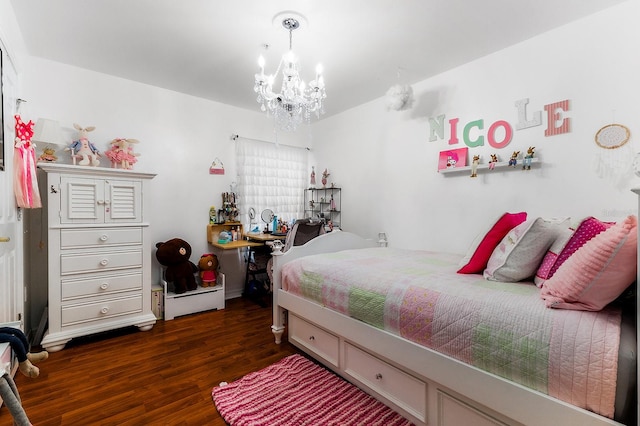 bedroom featuring dark wood-type flooring and a chandelier