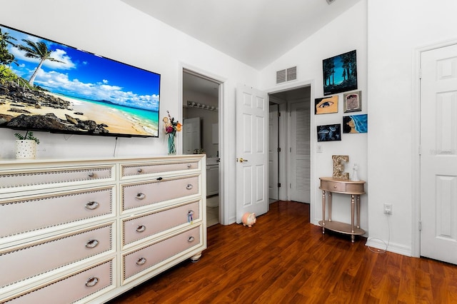 unfurnished bedroom featuring dark hardwood / wood-style flooring and lofted ceiling