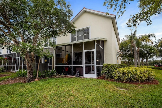 back of house with a yard