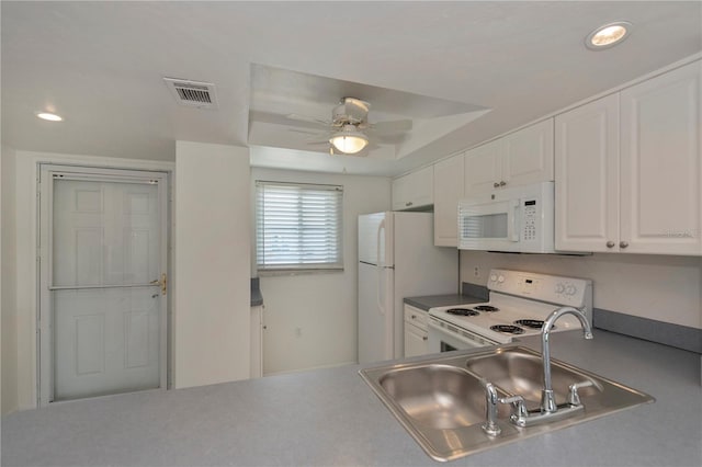 kitchen featuring white cabinetry, sink, ceiling fan, and white appliances