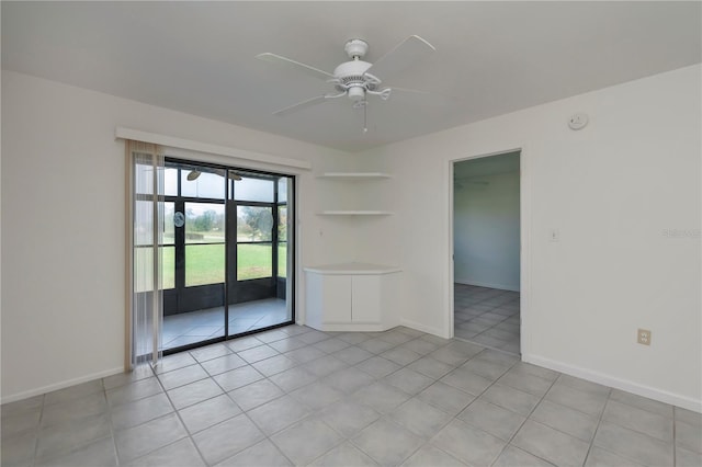 unfurnished room with light tile patterned floors and ceiling fan