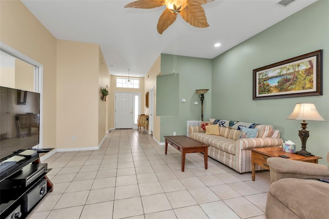 tiled living room featuring ceiling fan