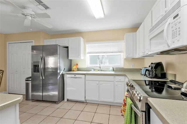 kitchen with ceiling fan, sink, white cabinets, and stainless steel appliances