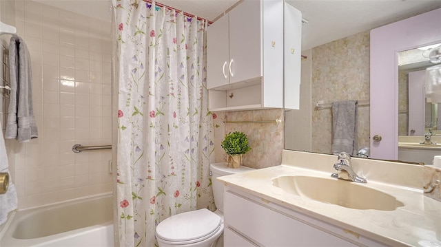 full bathroom with vanity, toilet, and shower / tub combo with curtain