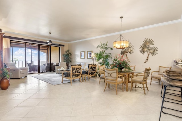 tiled dining space with ceiling fan with notable chandelier and ornamental molding