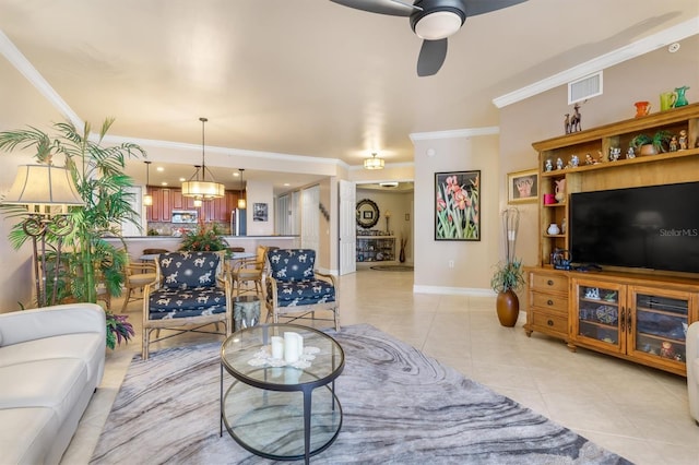 living room featuring light tile patterned floors, ceiling fan, and ornamental molding