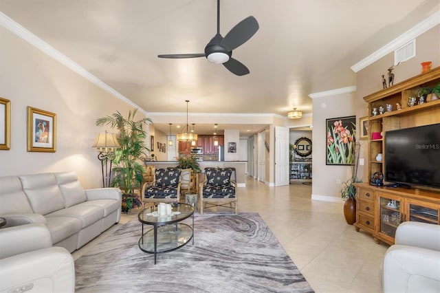 tiled living room with ceiling fan and crown molding