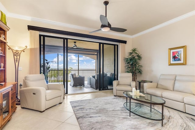 tiled living room featuring ceiling fan and ornamental molding