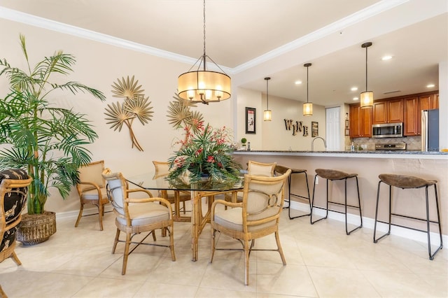 dining area featuring a notable chandelier, light tile patterned floors, and crown molding