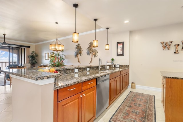 kitchen with dark stone counters, dishwasher, hanging light fixtures, and ornamental molding