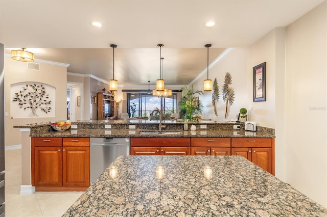 kitchen featuring stainless steel dishwasher, crown molding, sink, pendant lighting, and dark stone countertops