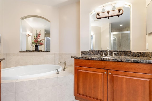 bathroom featuring vanity and plus walk in shower