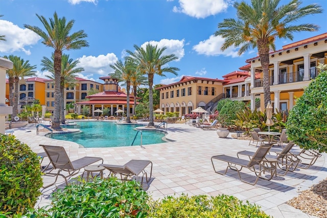 view of swimming pool featuring a patio area