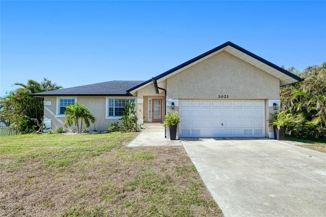 ranch-style home with a garage and a front yard