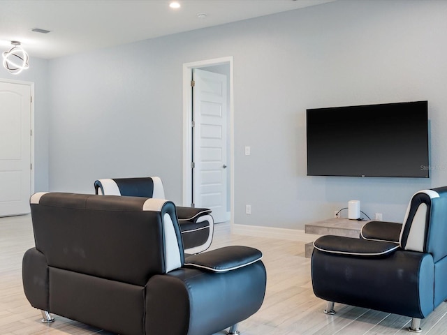 living room with light hardwood / wood-style floors