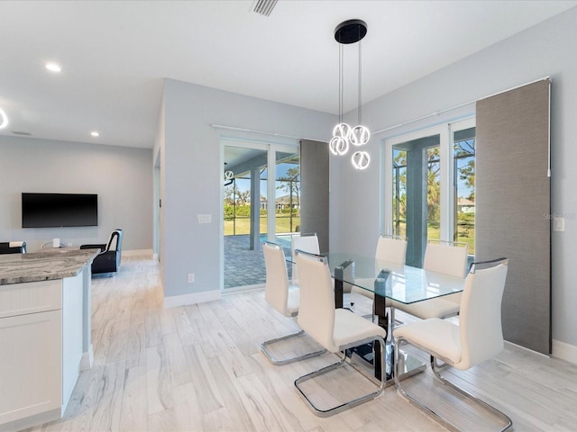 dining room with light wood-type flooring